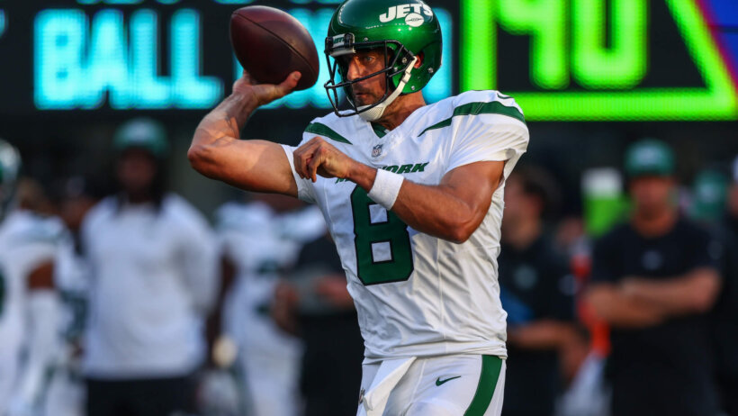 Aaron Rodgers throws a pass during the 2023 preseason.