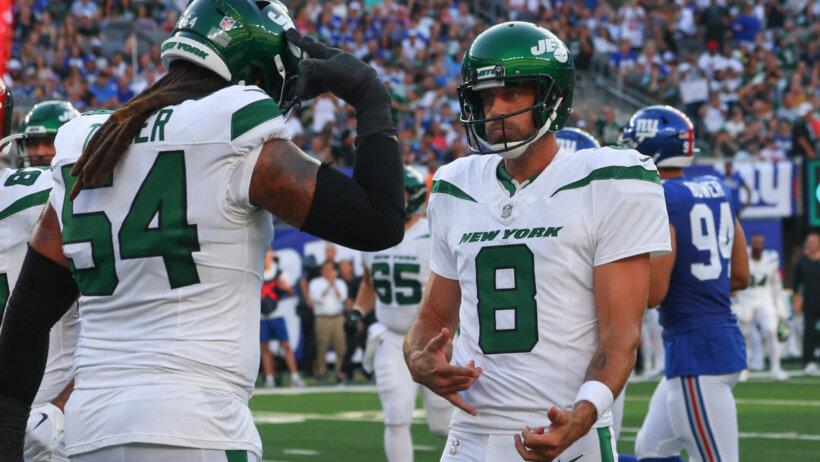 Aaron Rodgers celebrates a preseason TD pass