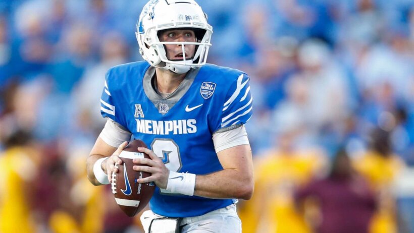 Seth Henigan drops back to pass