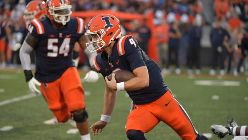 Illinois' Luke Altmyer scrambles versus Toledo.
