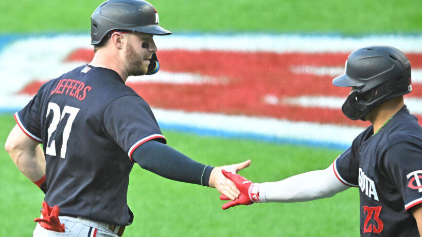Minnesota Twins catcher Ryan Jeffers celebrates with third baseman Royce Lewis