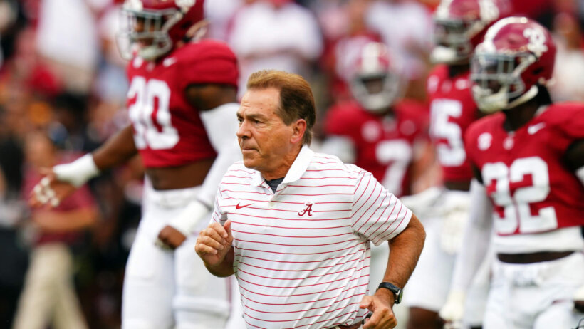 Alabama Crimson Tide head coach Nick Saban runs onto the field