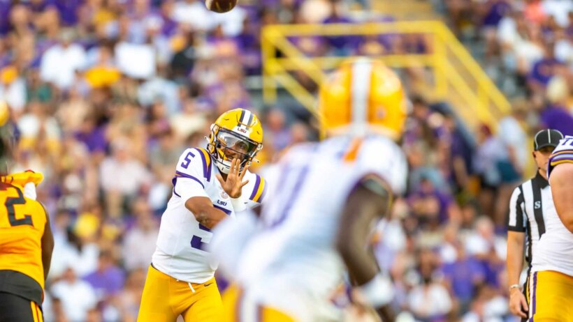 Tigers quarterback Jayden Daniels throwing a pass