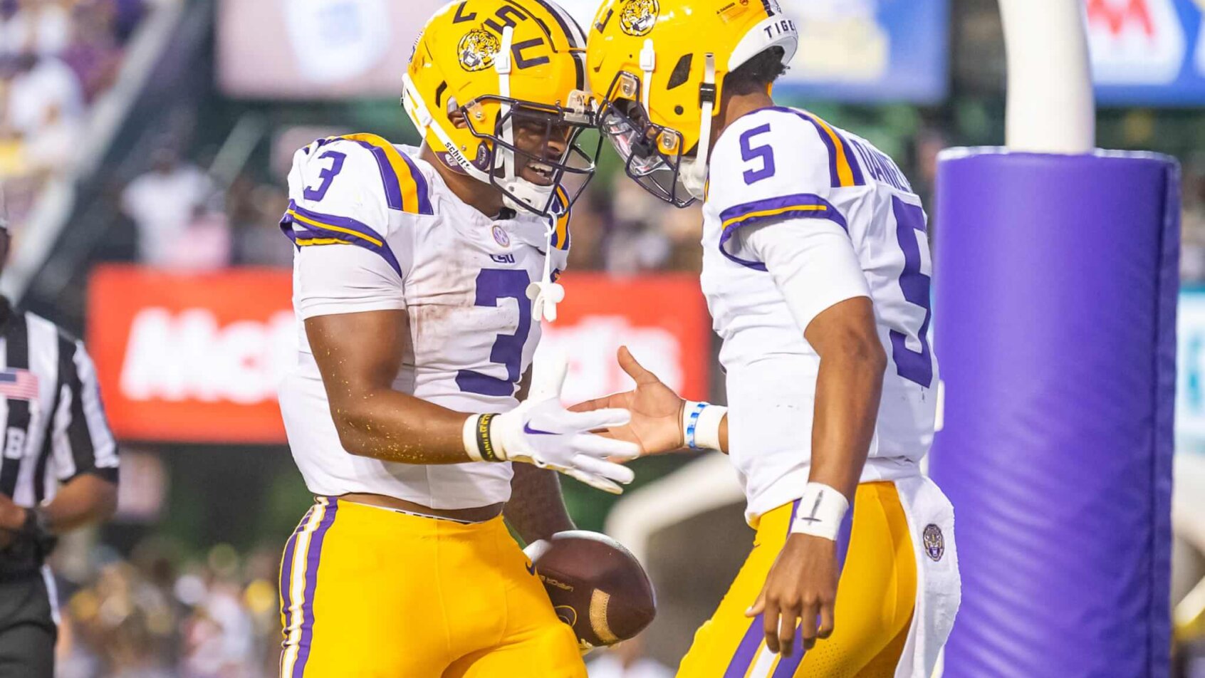 Tigers Quarterback Jayden Daniels celebrates with Logan Diggs