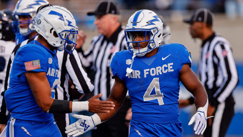 Air Force Falcons fullback Emmanuel Michel celebrates his touchdown with quarterback Zac Larrier
