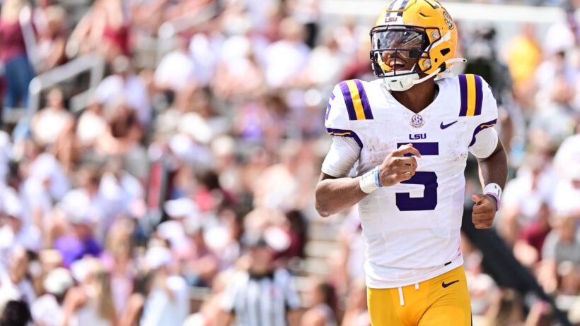 LSU Tigers quarterback Jayden Daniels reacts after a play