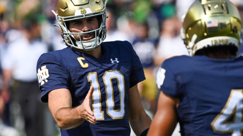 Notre Dame Fighting Irish quarterback Sam Hartman congratulates wide receiver Chris Tyree