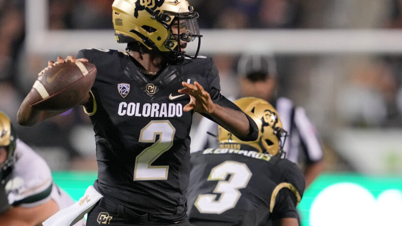 Colorado Buffaloes quarterback Shedeur Sanders passes the ball
