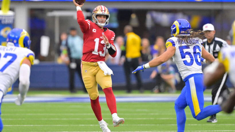 Brock Purdy (13) throws a pass