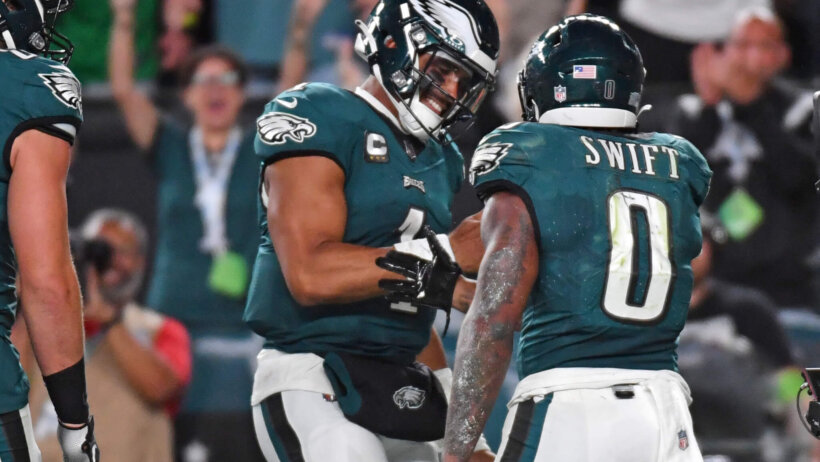 Philadelphia Eagles quarterback Jalen Hurts (1) and running back D'Andre Swift (0) celebrate touchdown