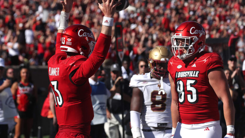 Louisville’s Jack Plummer celebrating a TD with Mason Reiger