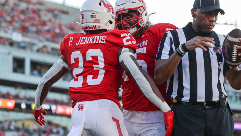 Houston Cougars running back Parker Jenkins (23) celebrates with offensive lineman Jack Freeman