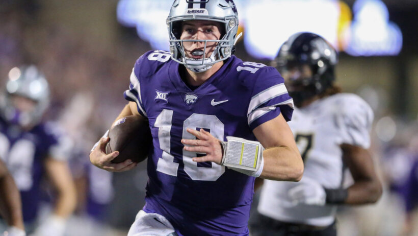 Kansas State Wildcats quarterback Will Howard runs away