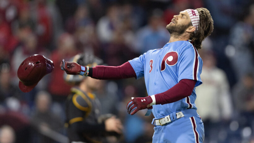 Philadelphia Phillies Bryce Harper throws his helmet in celebrating
