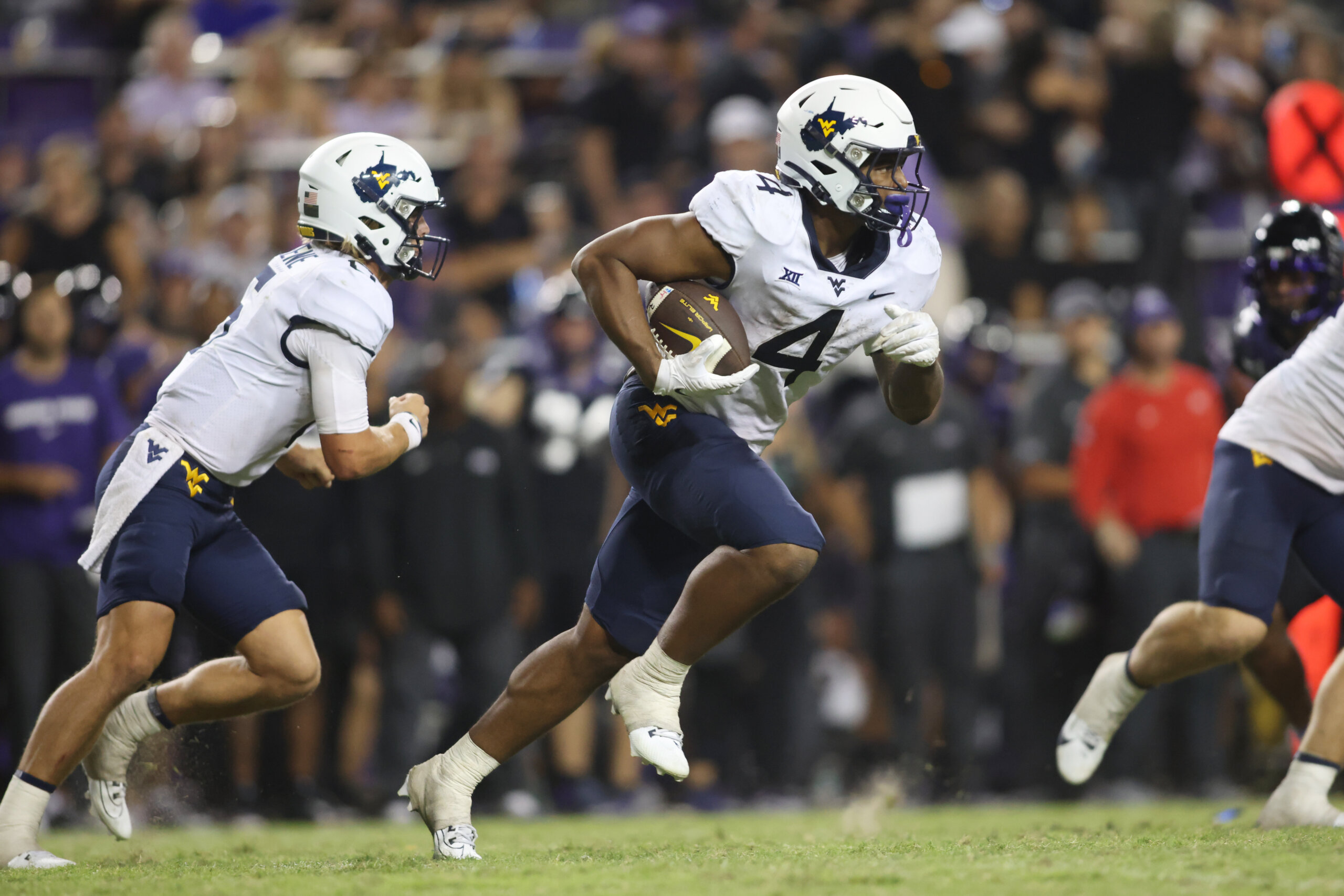 West Virginia Mountaineers running back CJ Donaldson Jr. runs the ball