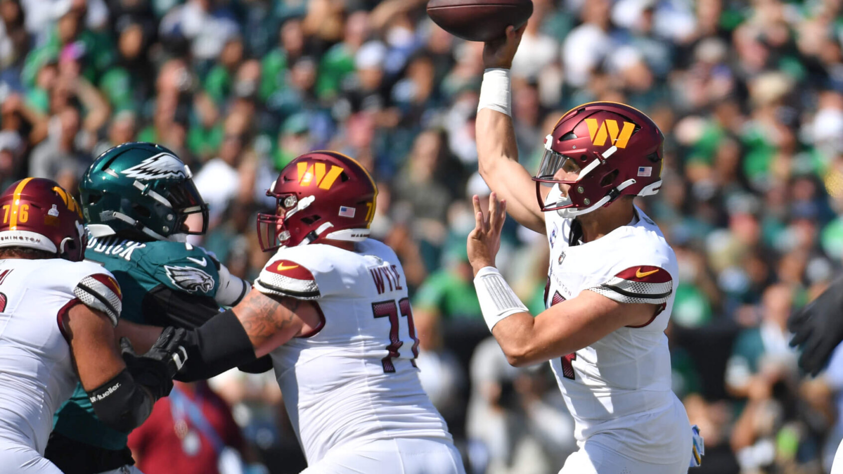 Washington Commanders quarterback Sam Howell (14) throws a pass