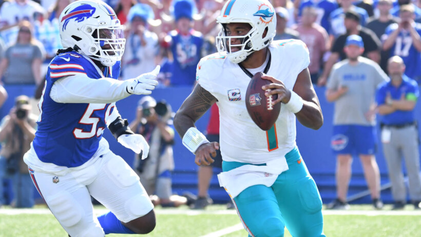 Miami Dolphins quarterback Tua Tagovailoa (1) is chased