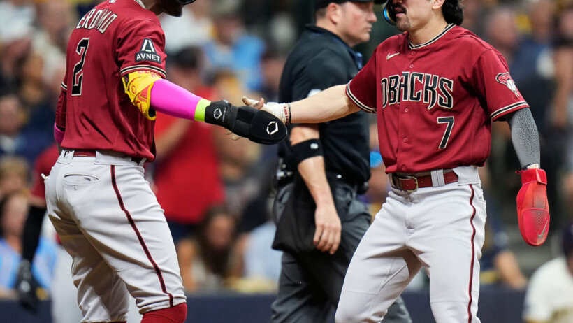 Arizona Diamondbacks shortstop Geraldo Perdomo celebrates with right fielder Corbin Carroll