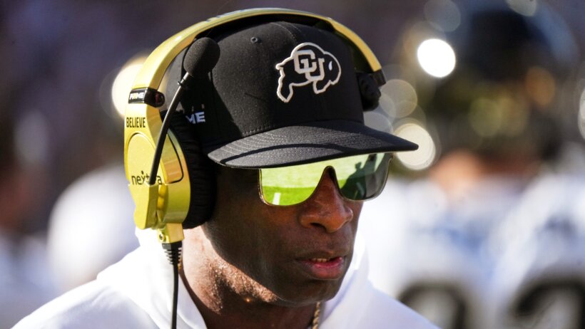 Colorado Buffaloes head coach Deion Sanders walks the sidelines