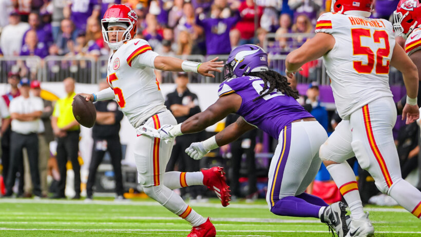 Kansas City Chiefs quarterback Patrick Mahomes (15) scrambles against the Minnesota Vikings