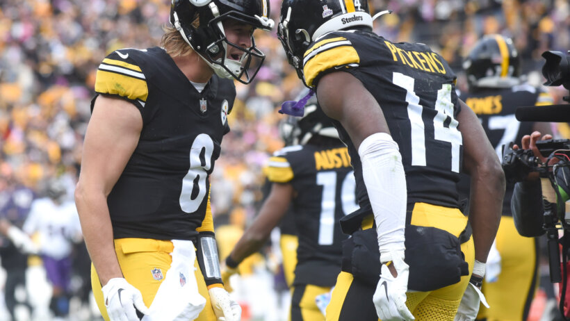 Pittsburgh Steelers quarterback Kenny Pickett (8) celebrates a game-winning touchdown with wide receiver George Pickens (14)