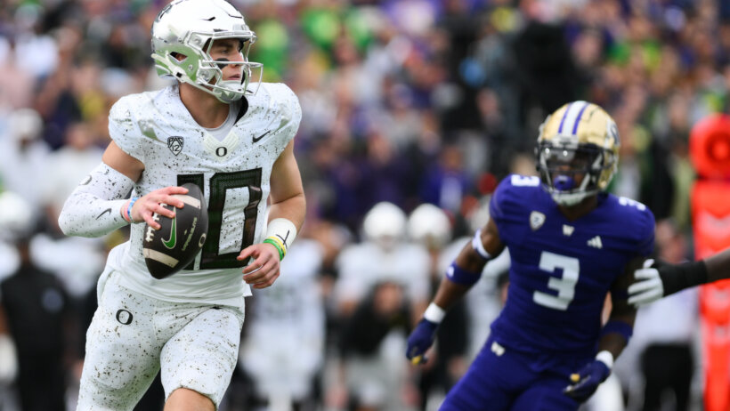 Oregon Ducks quarterback Bo Nix looks to pass the ball vs Washington
