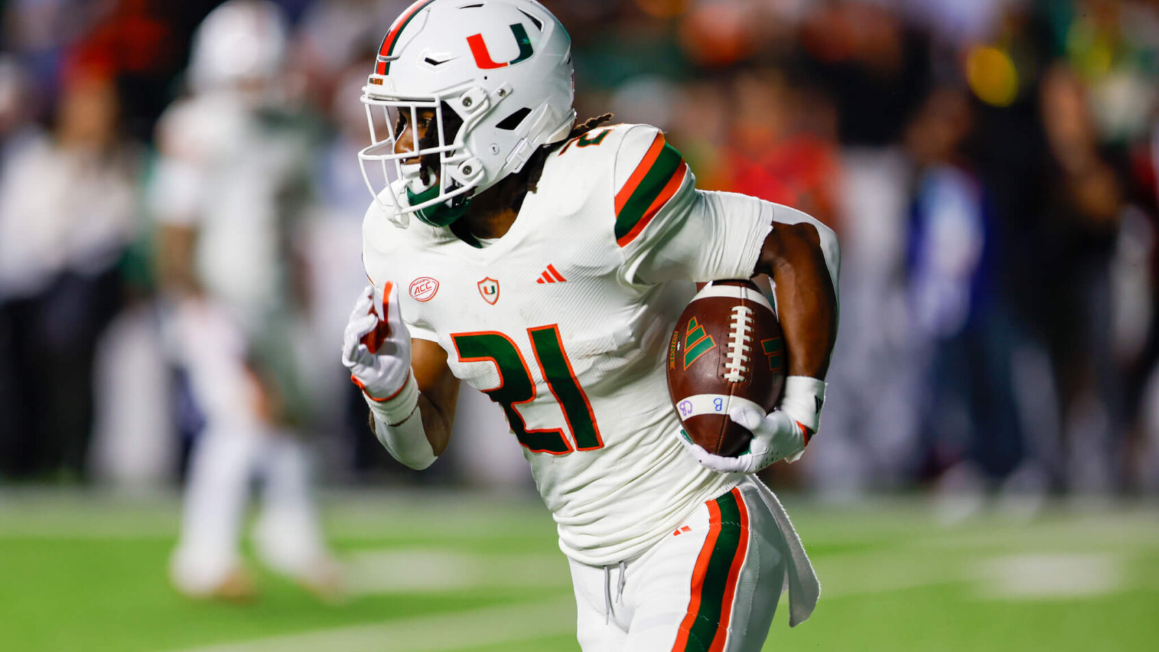 Miami Hurricanes running back Henry Parrish Jr. carries the football