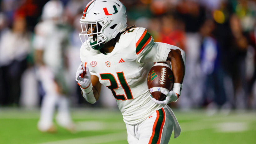 Miami Hurricanes running back Henry Parrish Jr. carries the football