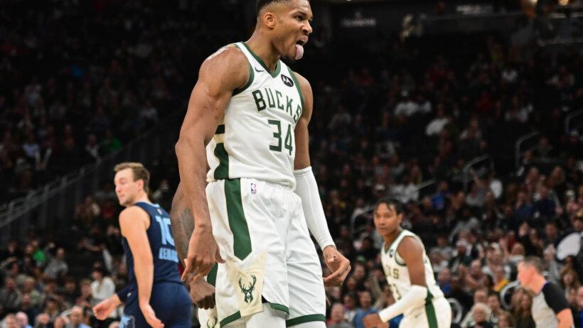 Milwaukee Bucks forward Giannis Antetokounmpo sticks his tongue out after a basket