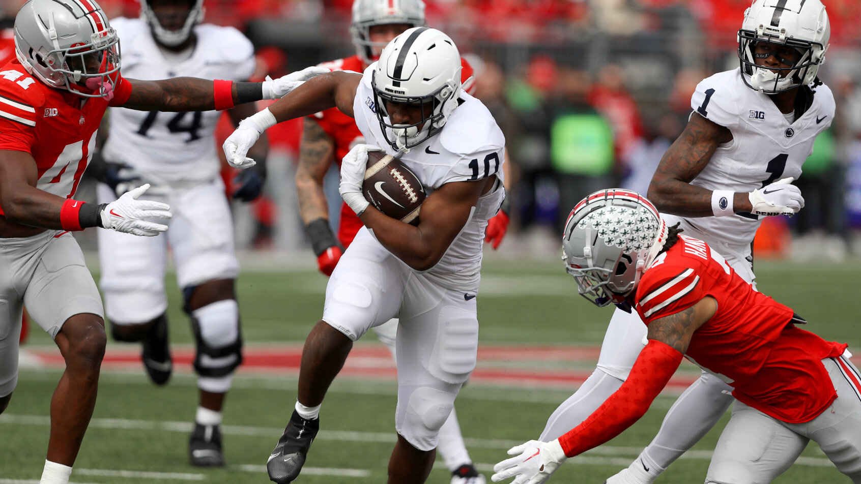 Penn State Nittany Lions running back Nicholas Singleton runs the bal