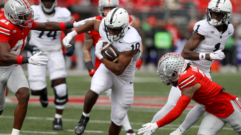 Penn State Nittany Lions running back Nicholas Singleton runs the bal
