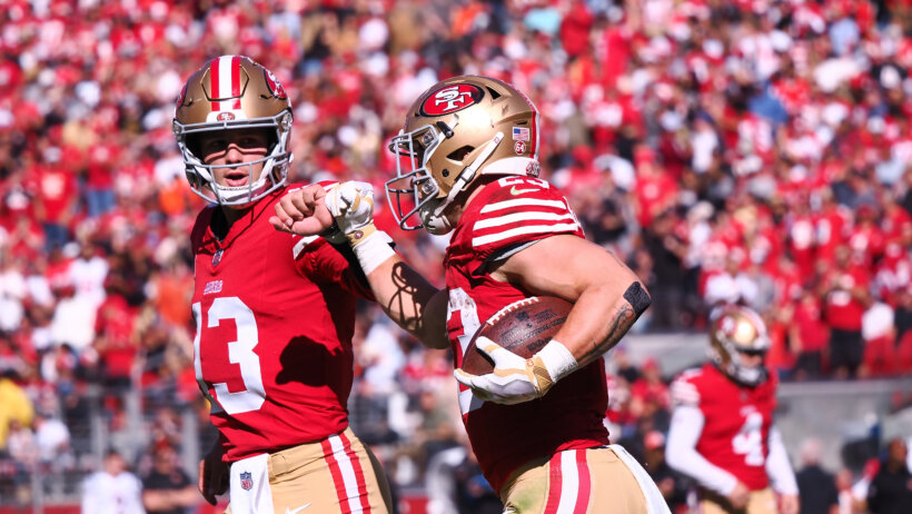 San Francisco 49ers running back Christian McCaffrey (23) celebrates wtith quarterback Brock Purdy
