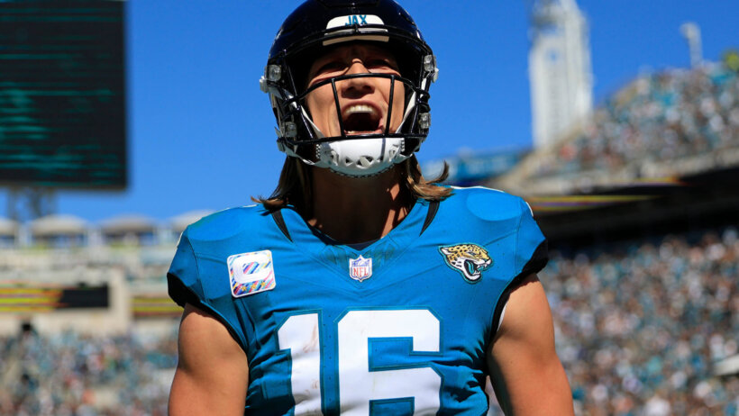 Jacksonville Jaguars quarterback Trevor Lawrence (16) yells after wide receiver Christian Kirk (13), not shown, caught a pass for a touchdown