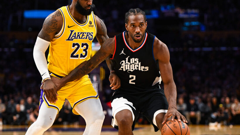LA Clippers forward Kawhi Leonard moves the ball against Los Angeles Lakers forward LeBron James