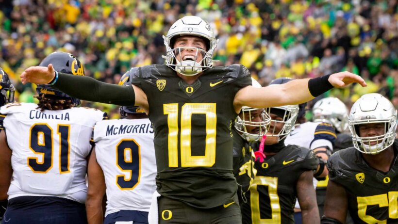 Oregon quarterback Bo Nix celebrates a touchdown