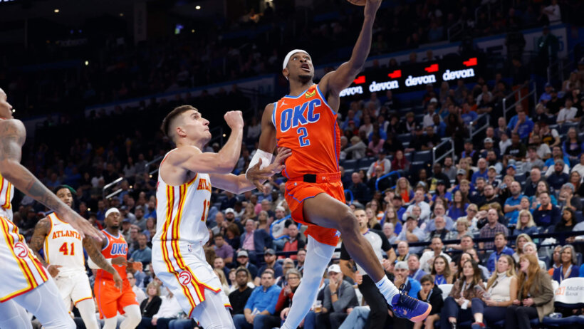 Oklahoma City Thunder guard Shai Gilgeous-Alexander shooting a layup against the Atlanta Hawks