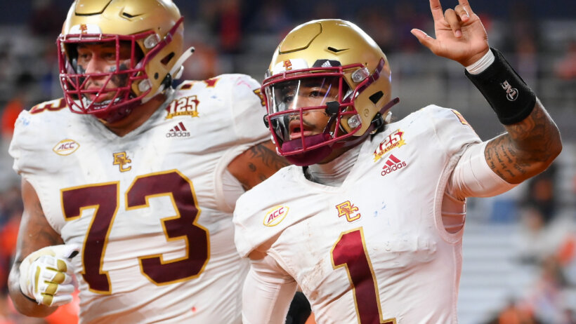 Boston College Eagles quarterback Thomas Castellanos celebrates his touchdown run
