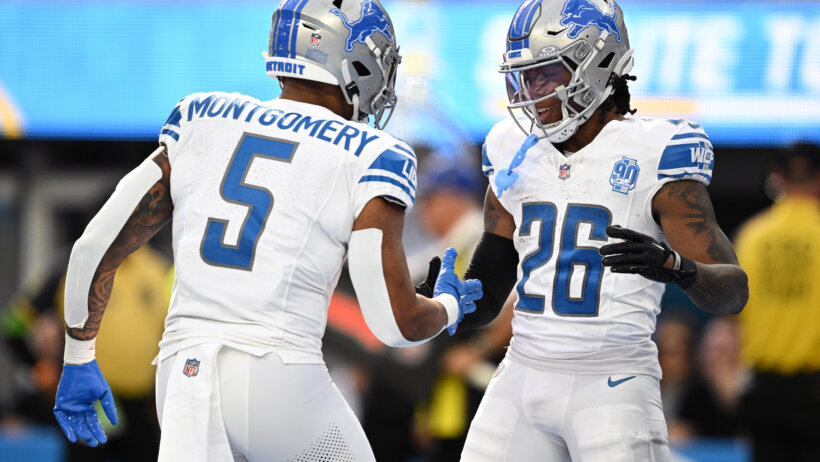 Detroit Lions running back Jahmyr Gibbs (26) celebrates with running back David Montgomery (5) after scoring a touchdown