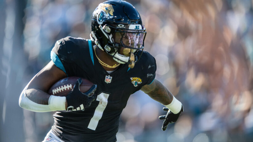 Jacksonville Jaguars running back Travis Etienne Jr. (1) runs the ball