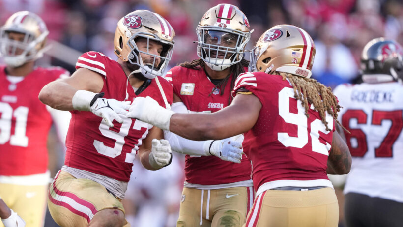 San Francisco 49ers defensive players celebrating together