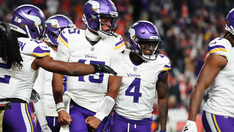 Minnesota Viking quarterback Joshua Dobbs (15) reacts after scoring a touchdown against the Denver Broncos