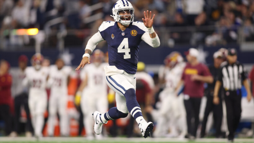 Dallas Cowboys Dak Prescott running celebrating touchdown