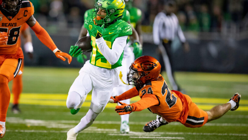 Oregon wide receiver Tez Johnson running with the ball
