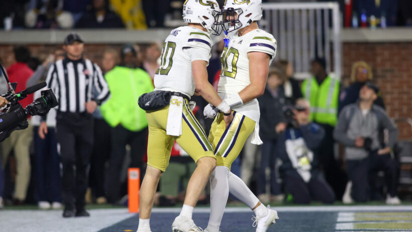 Georgia Tech Yellow Jackets quarterback Haynes King celebrates with tight end Brett Seither
