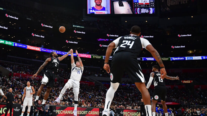 Dallas Mavericks guard Luka Doncic shoots over LA Clippers forward Kawhi Leonard