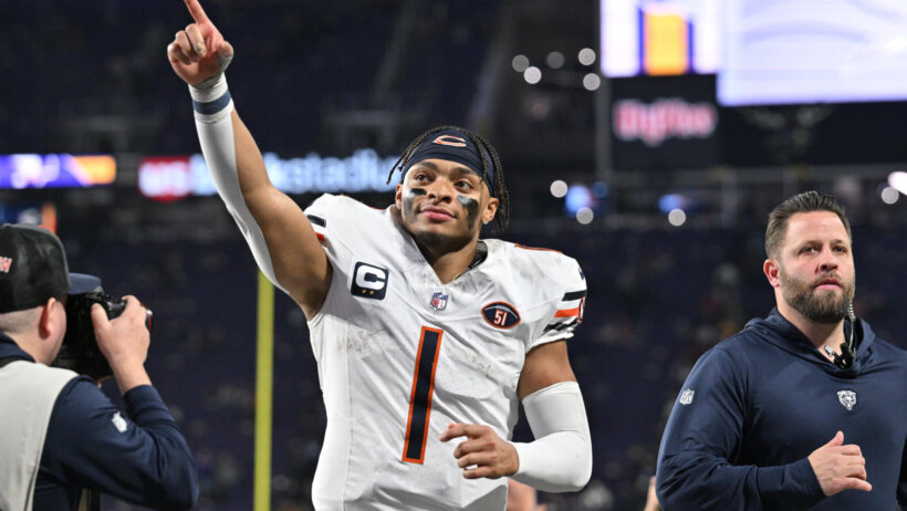 Chicago Bears quarterback Justin Fields (1) runs off the field after the game