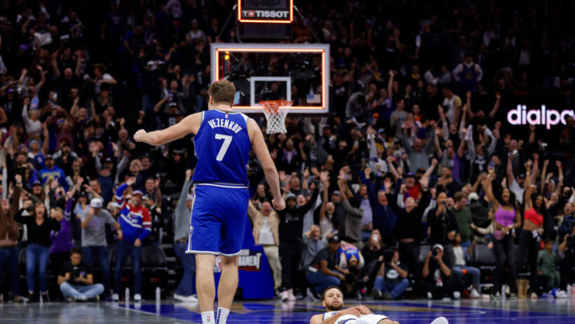 Golden State Warriors guard Stephen Curry lays on the court after missing a last-second shot against the Sacramento Kings