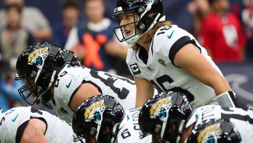 Jacksonville Jaguars quarterback Trevor Lawrence (16) calls an audible