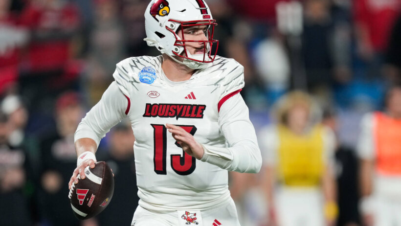 Louisville Cardinals quarterback Jack Plummer scrambles