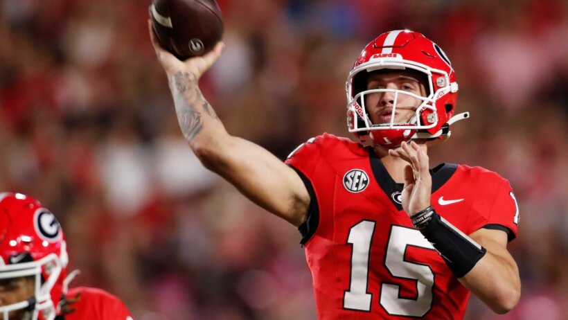 Georgia quarterback Carson Beck throws a touchdown pass